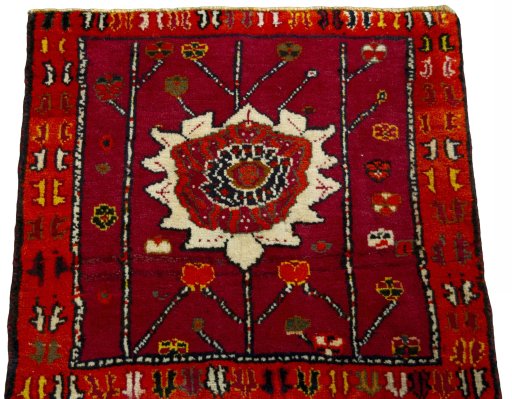 Surface texture of 2000s Shiraz rug with natural Wool and intricate pattern