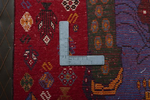 Backside of handmade 2000s Shiraz rug showing knot structure and weave density