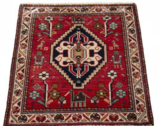 Surface texture of 2000s Shiraz rug with natural Wool and intricate pattern