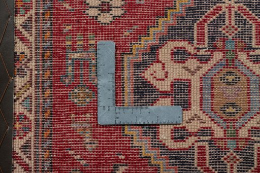 Backside of handmade 2000s Shiraz rug showing knot structure and weave density