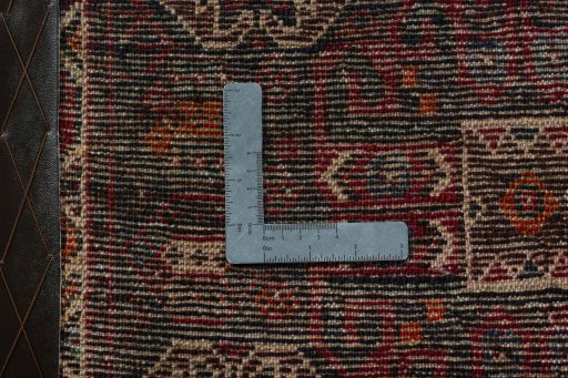 Backside of handmade 2000s Shiraz rug showing knot structure and weave density