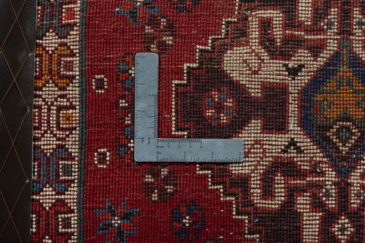 Backside of handmade 2000s Shiraz rug showing knot structure and weave density