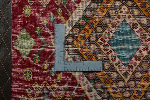 Backside of handmade 2000s Shiraz rug showing knot structure and weave density
