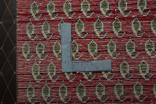 Backside of handmade 2000s Shiraz rug showing knot structure and weave density