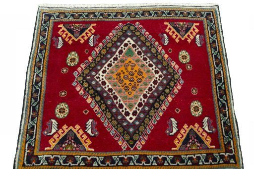 Surface texture of 2000s Shiraz rug with natural Wool and intricate pattern