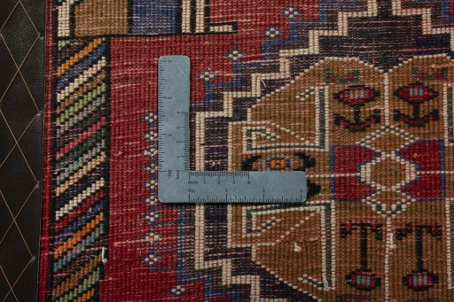 Backside of handmade 2000s Shiraz rug showing knot structure and weave density