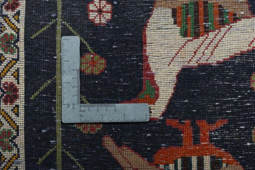 Backside of handmade 2000s Shiraz rug showing knot structure and weave density
