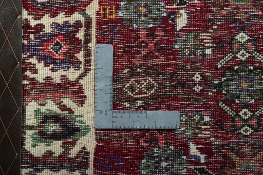 Backside of handmade 2000s Shiraz rug showing knot structure and weave density