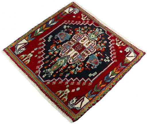 Corner detail of 2000s Shiraz rug showing border pattern and Wool pile