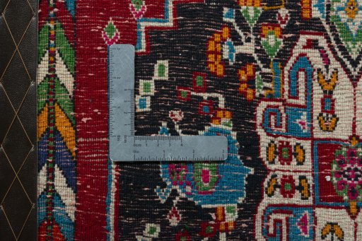 Backside of handmade 2000s Shiraz rug showing knot structure and weave density