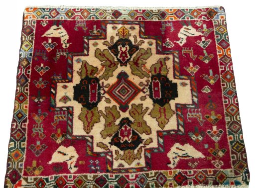 Surface texture of 2000s Shiraz rug with natural Wool and intricate pattern