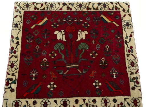 Surface texture of 2000s Shiraz rug with natural Wool and intricate pattern