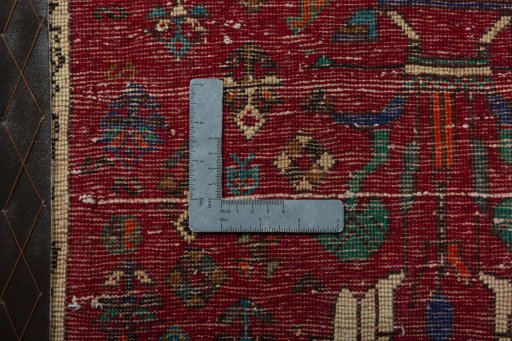 Backside of handmade 2000s Shiraz rug showing knot structure and weave density