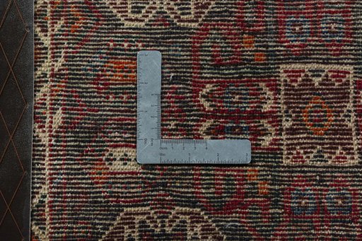 Backside of handmade 2000s Shiraz rug showing knot structure and weave density
