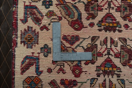 Backside of handmade 2000s Shiraz rug showing knot structure and weave density