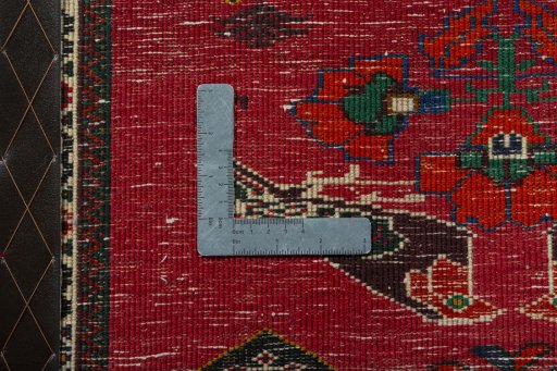 Backside of handmade 2000s Shiraz rug showing knot structure and weave density