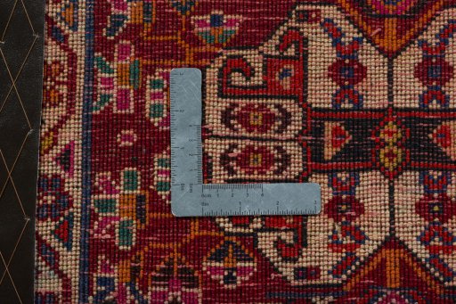 Backside of handmade 2000s Shiraz rug showing knot structure and weave density