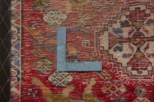 Backside of handmade 2000s Shiraz rug showing knot structure and weave density