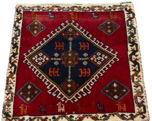 Surface texture of 2000s Shiraz rug with natural Wool and intricate pattern