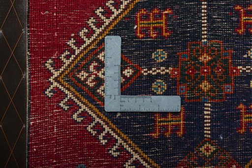 Backside of handmade 2000s Shiraz rug showing knot structure and weave density