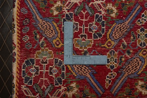 Backside of handmade 2000s Shiraz rug showing knot structure and weave density