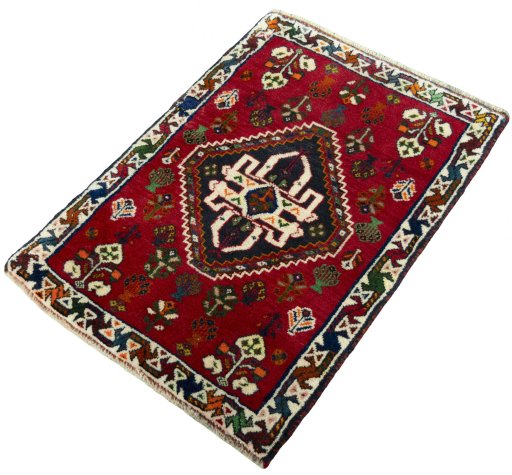 Corner detail of 2000s Shiraz rug showing border pattern and Wool pile