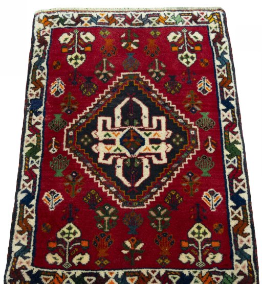 Surface texture of 2000s Shiraz rug with natural Wool and intricate pattern