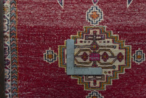 Backside of handmade 2000s Shiraz rug showing knot structure and weave density