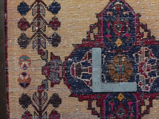 Backside of handmade 2000s Shiraz rug showing knot structure and weave density