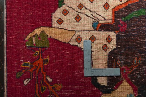 Backside of handmade 2000s Shiraz rug showing knot structure and weave density