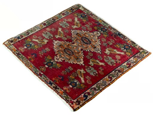 Corner detail of 2000s Shiraz rug showing border pattern and Wool pile