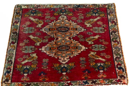 Surface texture of 2000s Shiraz rug with natural Wool and intricate pattern