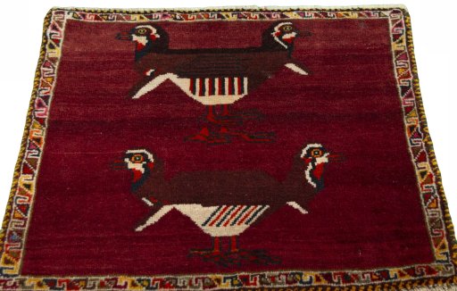 Surface texture of 2000s Shiraz rug with natural Wool and intricate pattern