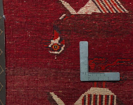 Backside of handmade 2000s Shiraz rug showing knot structure and weave density