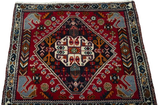 Surface texture of 2000s Shiraz rug with natural Wool and intricate pattern