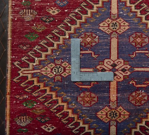 Backside of handmade 2000s Shiraz rug showing knot structure and weave density