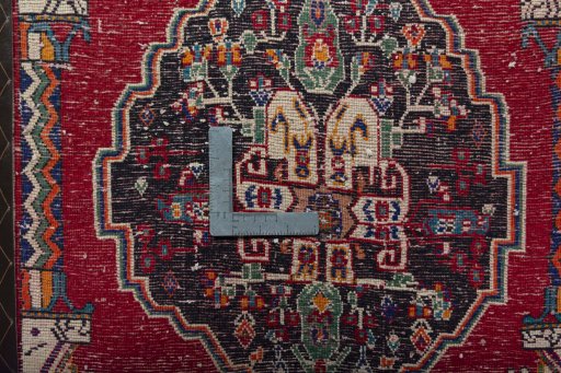 Backside of handmade 2000s Shiraz rug showing knot structure and weave density