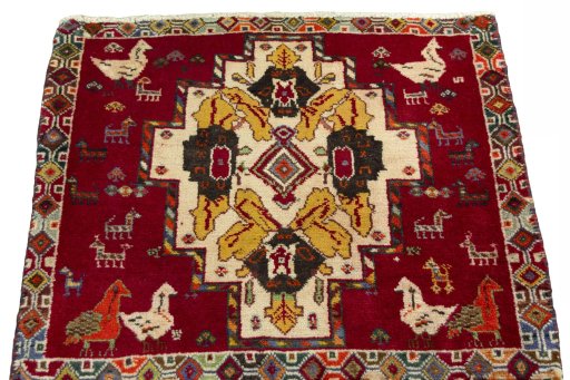 Surface texture of 2000s Shiraz rug with natural Wool and intricate pattern