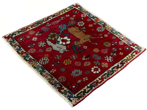 Corner detail of 2000s Shiraz rug showing border pattern and Wool pile