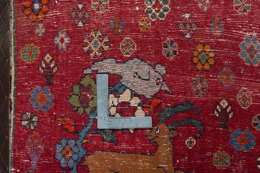 Backside of handmade 2000s Shiraz rug showing knot structure and weave density