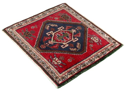 Corner detail of 2000s Shiraz rug showing border pattern and Wool pile
