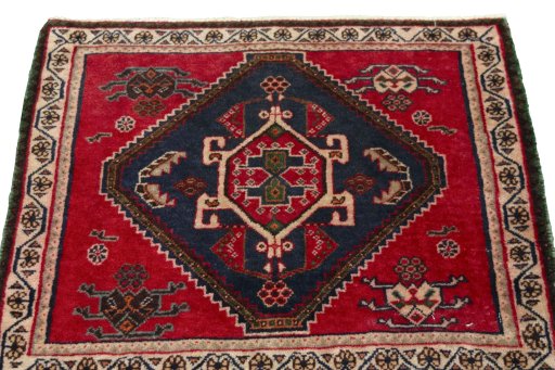 Surface texture of 2000s Shiraz rug with natural Wool and intricate pattern