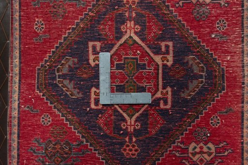Backside of handmade 2000s Shiraz rug showing knot structure and weave density