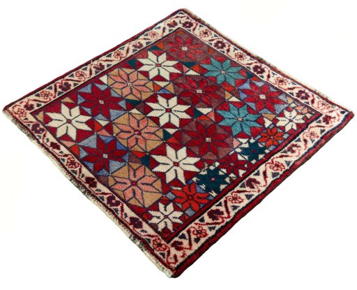 Corner detail of 2000s Shiraz rug showing border pattern and Wool pile