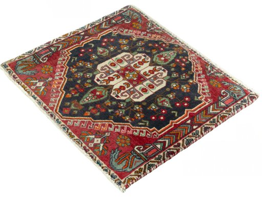 Corner detail of 2000s Shiraz rug showing border pattern and Wool pile