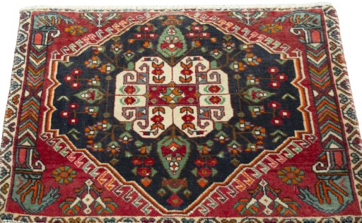 Surface texture of 2000s Shiraz rug with natural Wool and intricate pattern