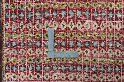 Backside of handmade 2000s Shiraz rug showing knot structure and weave density