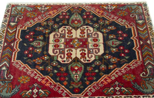 Surface texture of 2000s Shiraz rug with natural Wool and intricate pattern