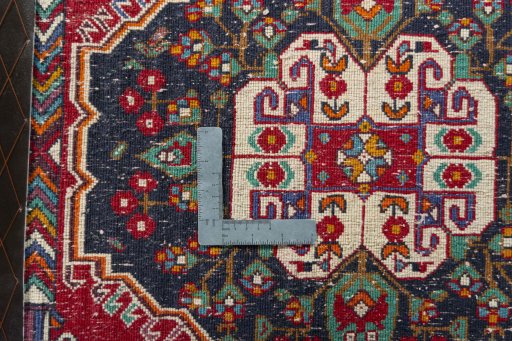 Backside of handmade 2000s Shiraz rug showing knot structure and weave density