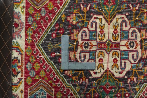 Backside of handmade 2000s Shiraz rug showing knot structure and weave density